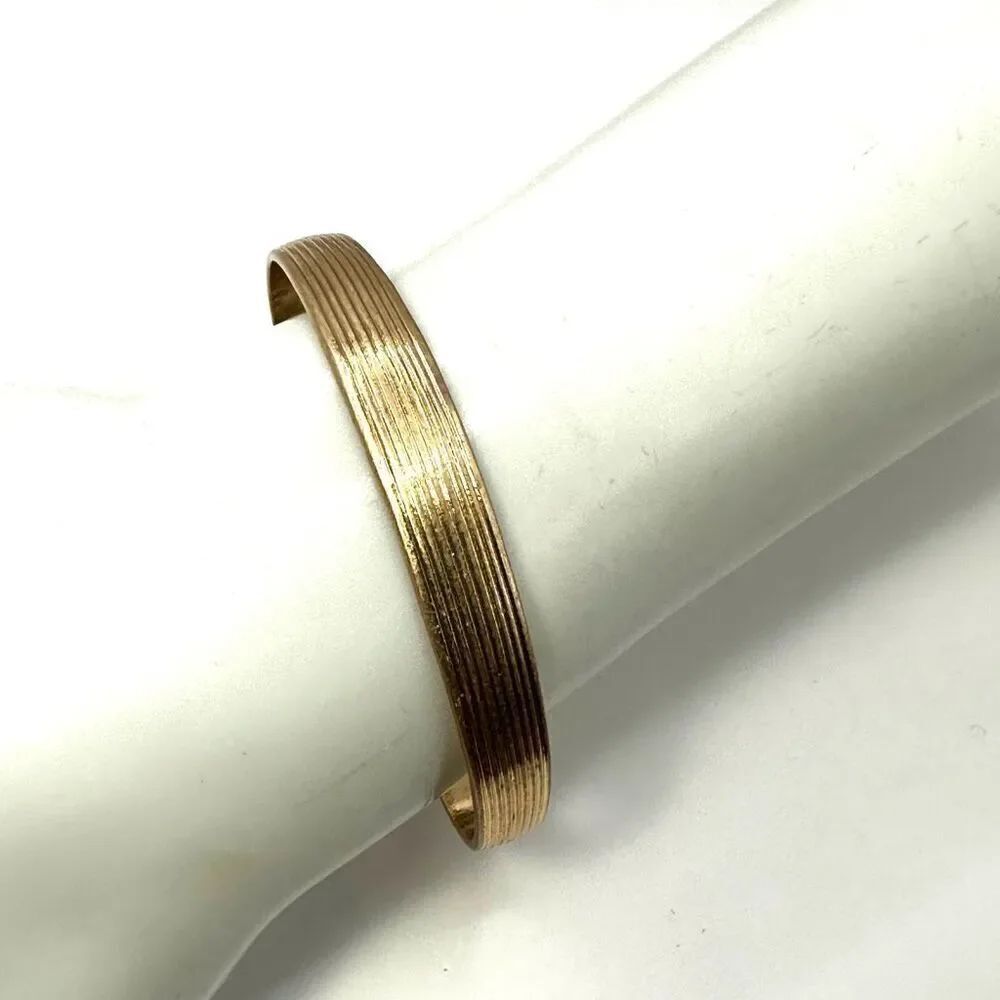 Small gold tone bangle bracelet